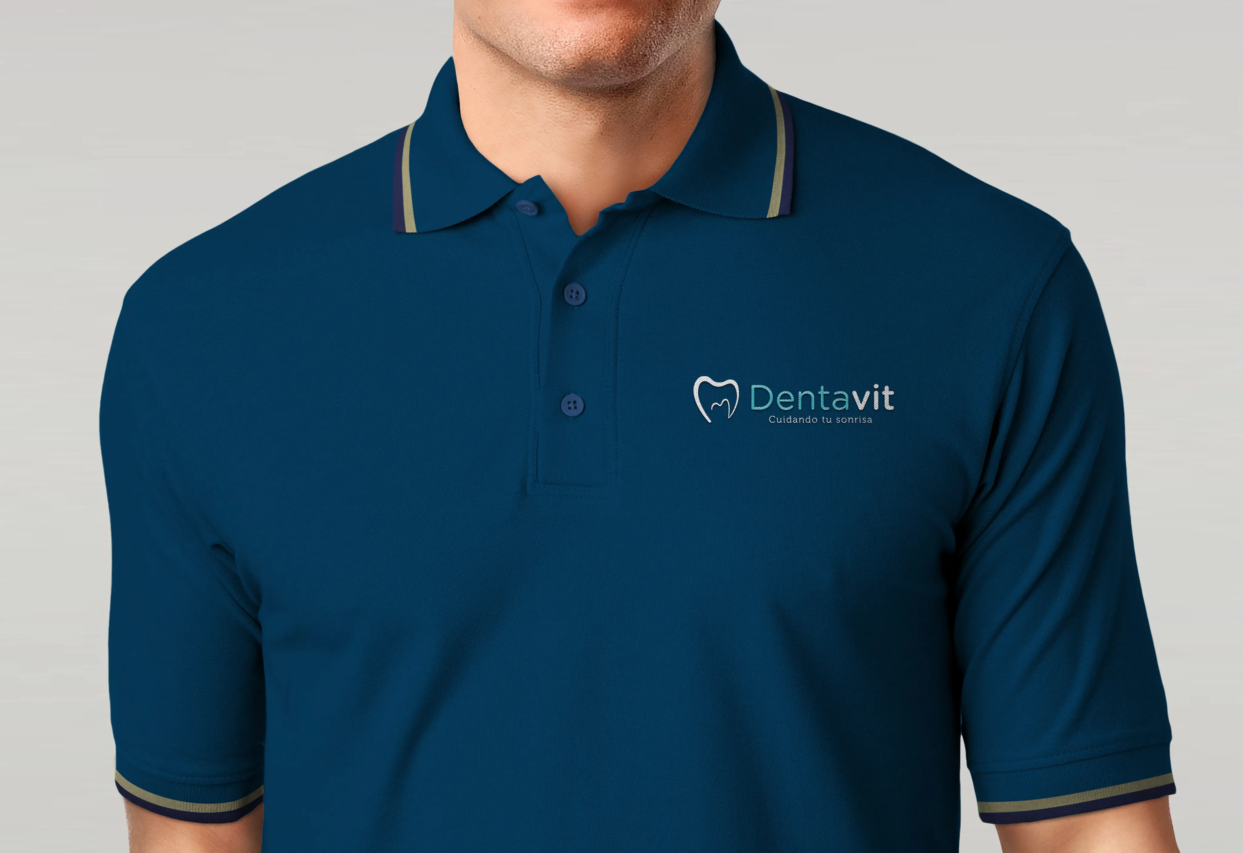 Mockup of a person wearing a t-shirt with the Dentavit logo printed on the chest, photographed against a neutral background.